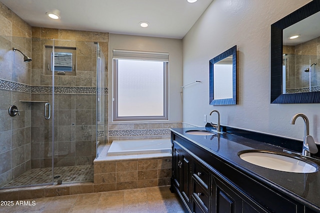 bathroom featuring a stall shower and a sink