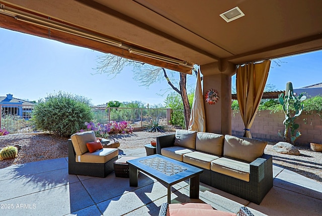 view of patio featuring a fenced backyard and outdoor lounge area