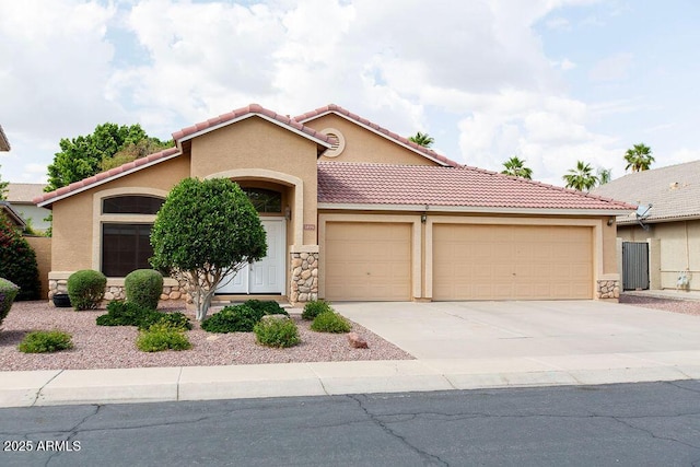 1894 E Sagebrush St, Gilbert, AZ 85296 - ranch-style house with an attached garage, stucco siding, stone siding, a tile roof, and concrete driveway