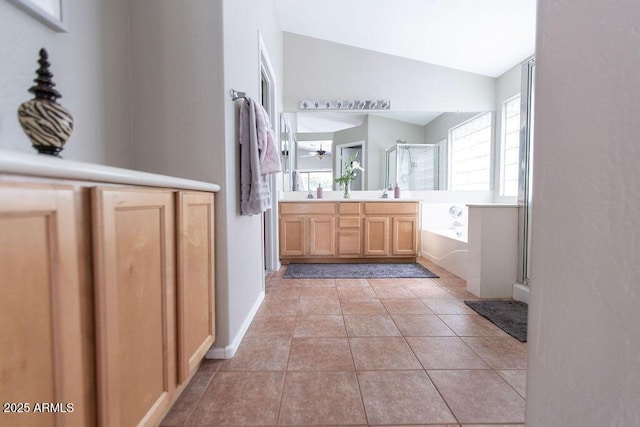 1894 E Sagebrush St, Gilbert, AZ 85296 - full bath with a stall shower, vaulted ceiling, a garden tub, double vanity, and tile patterned flooring
