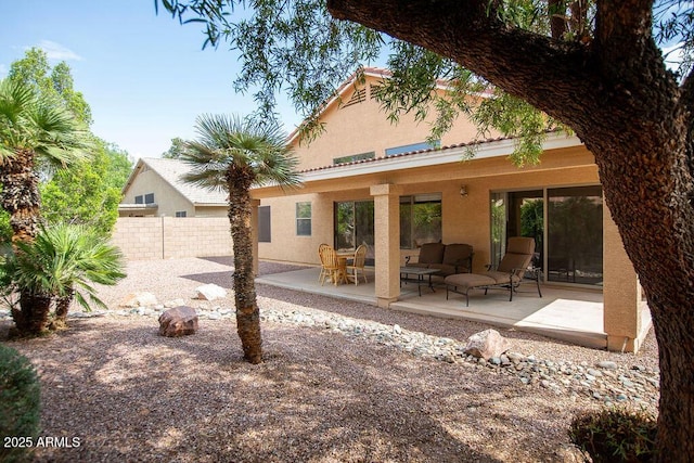 1894 E Sagebrush St, Gilbert, AZ 85296 - back of house featuring stucco siding, fence, a patio area, and an outdoor living space