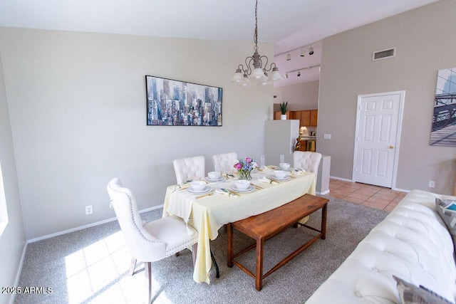 1894 E Sagebrush St, Gilbert, AZ 85296 - dining area with a chandelier, track lighting, baseboards, and light tile patterned floors