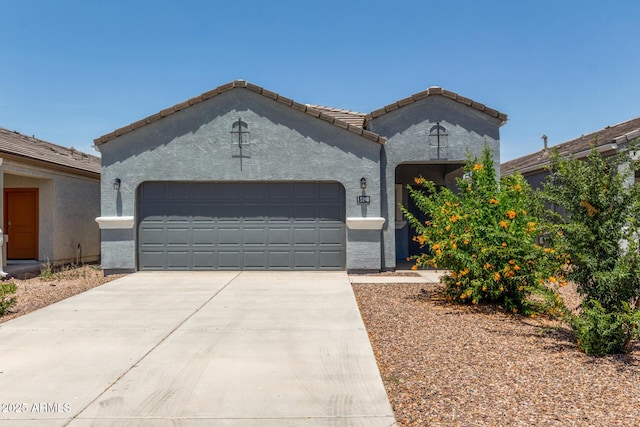5240 E Gummite Dr, San Tan Valley, AZ 85143 - view of front of home featuring a garage, driveway, stucco siding, and a tile roof