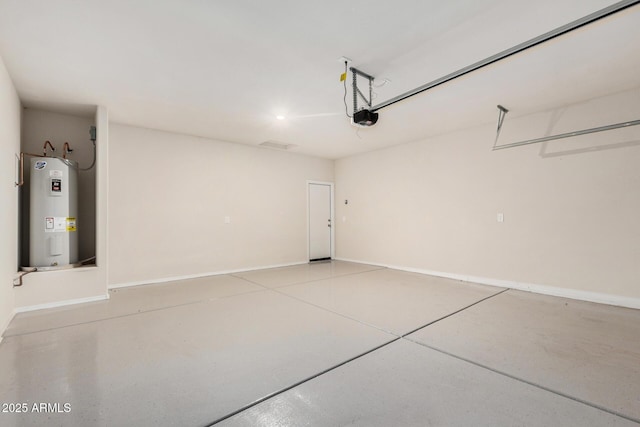 5240 E Gummite Dr, San Tan Valley, AZ 85143 - garage with electric water heater, a garage door opener, and baseboards