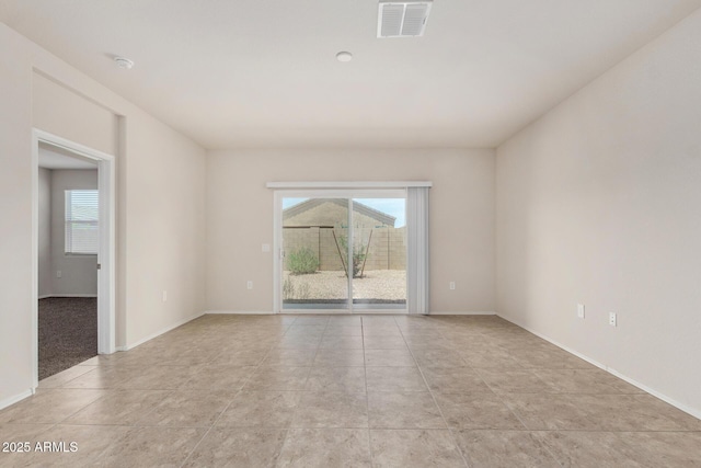 5240 E Gummite Dr, San Tan Valley, AZ 85143 - empty room featuring plenty of natural light, baseboards, and a smoke detector