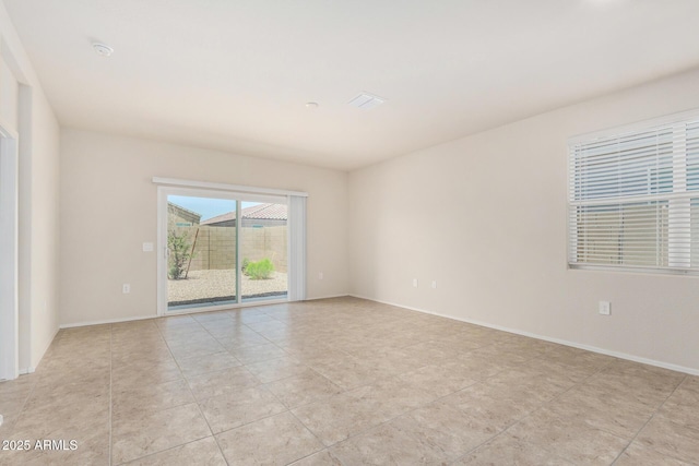 5240 E Gummite Dr, San Tan Valley, AZ 85143 - unfurnished room featuring light tile patterned flooring and baseboards