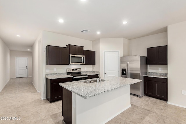 5240 E Gummite Dr, San Tan Valley, AZ 85143 - kitchen with appliances with stainless steel finishes, a sink, a center island with sink, recessed lighting, and dark brown cabinets