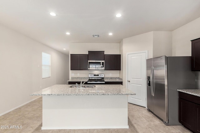 5240 E Gummite Dr, San Tan Valley, AZ 85143 - kitchen with stainless steel appliances, an island with sink, recessed lighting, and light stone counters