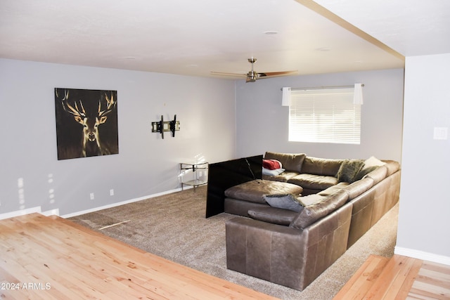 living room featuring ceiling fan and wood-type flooring