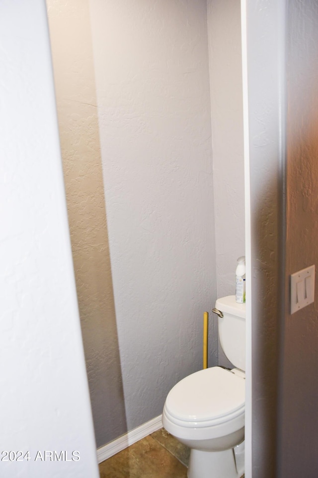 bathroom with tile patterned floors and toilet