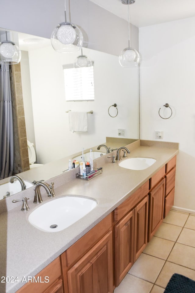 bathroom with tile patterned floors and vanity