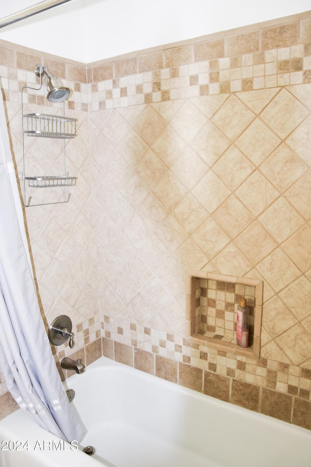 bathroom with shower / tub combo