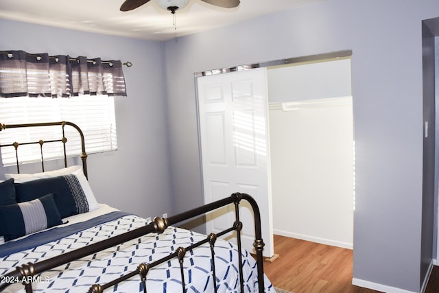 bedroom featuring a closet, hardwood / wood-style flooring, and ceiling fan