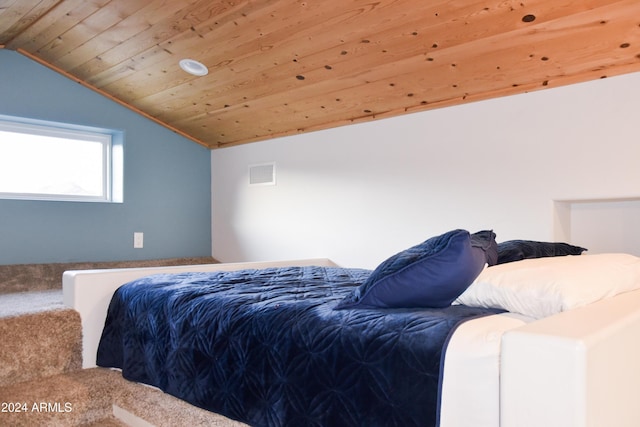 bedroom featuring wooden ceiling and vaulted ceiling