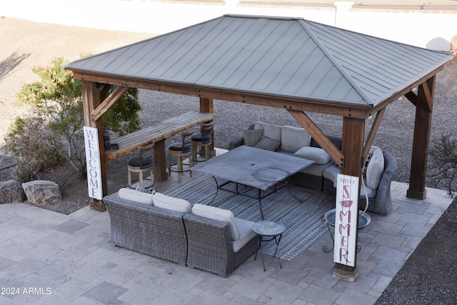 view of patio with a gazebo and an outdoor living space