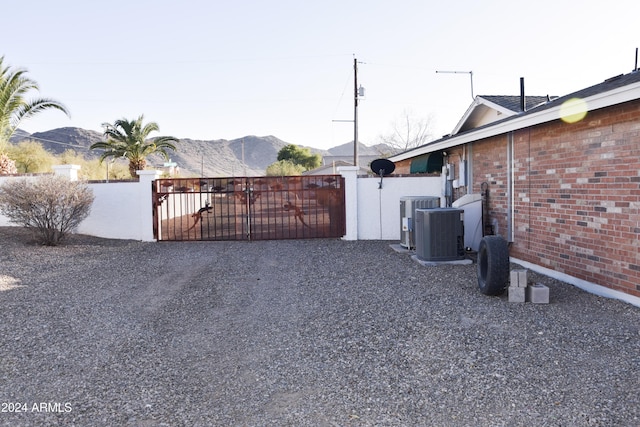 exterior space with central air condition unit and a mountain view