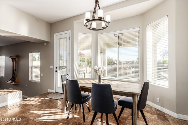 dining space featuring a chandelier and a healthy amount of sunlight