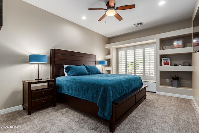 bedroom with light colored carpet and ceiling fan