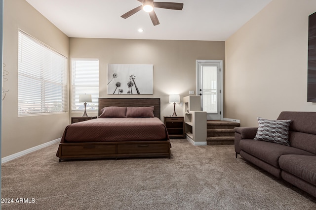 bedroom featuring light colored carpet and ceiling fan