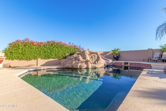 view of pool featuring a patio area