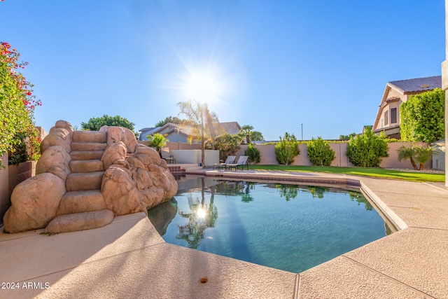 view of swimming pool with a patio area