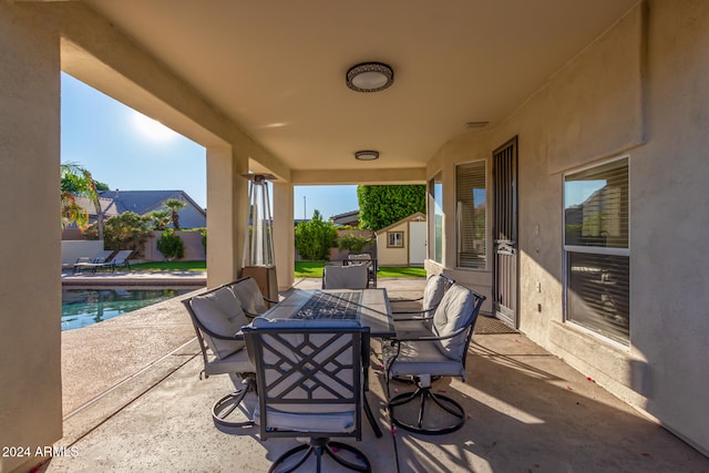 view of patio featuring an outdoor living space and a fenced in pool