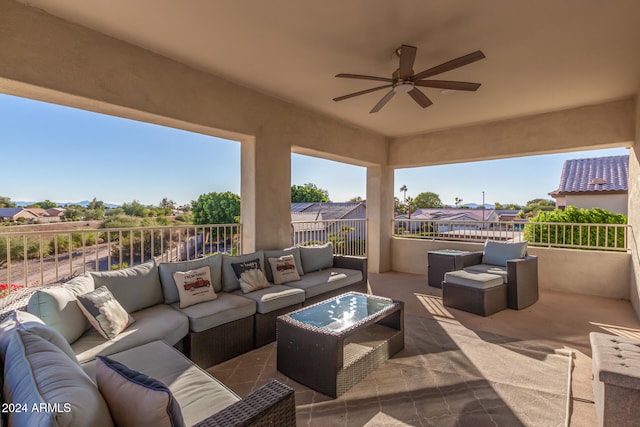 view of patio with an outdoor living space and ceiling fan