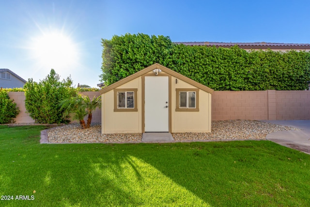 view of outdoor structure with a yard