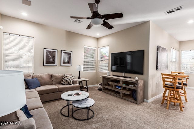 living room featuring ceiling fan and carpet floors