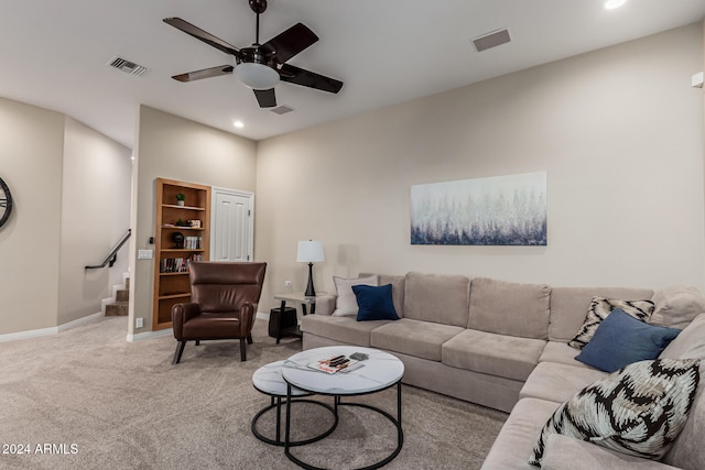 carpeted living room featuring ceiling fan