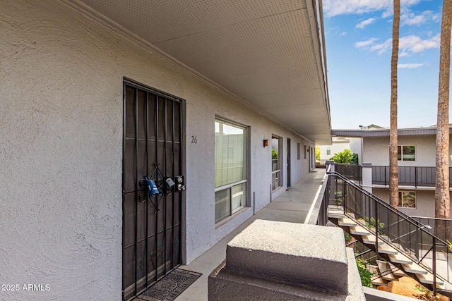property entrance with stucco siding