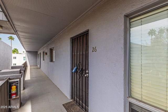 property entrance featuring stucco siding