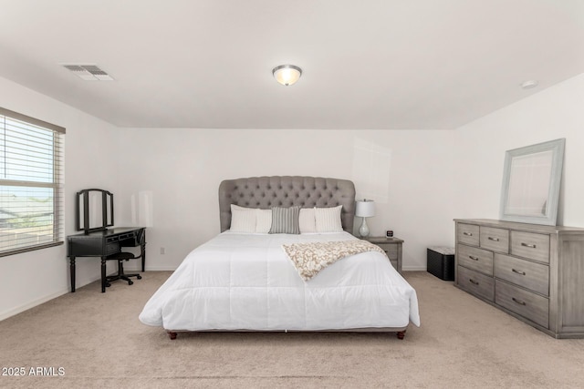 bedroom featuring light carpet, baseboards, and visible vents