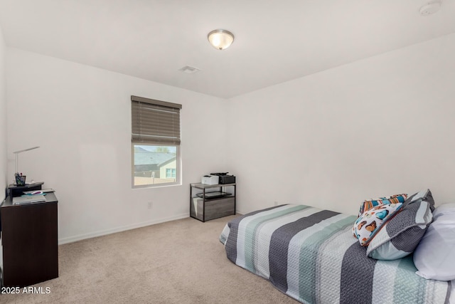 bedroom featuring light colored carpet, visible vents, and baseboards