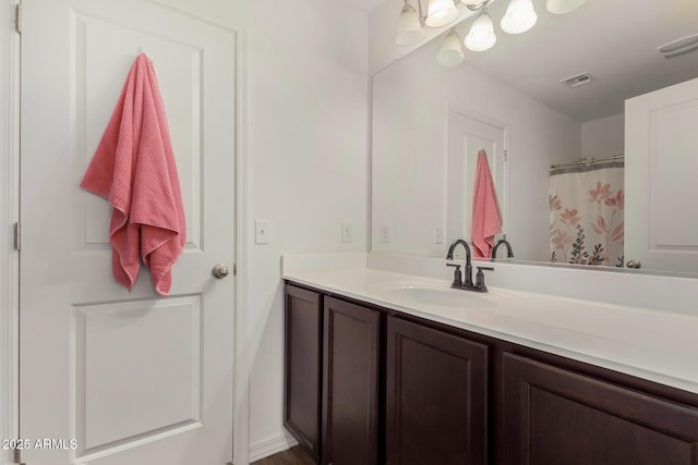 full bathroom with vanity and visible vents