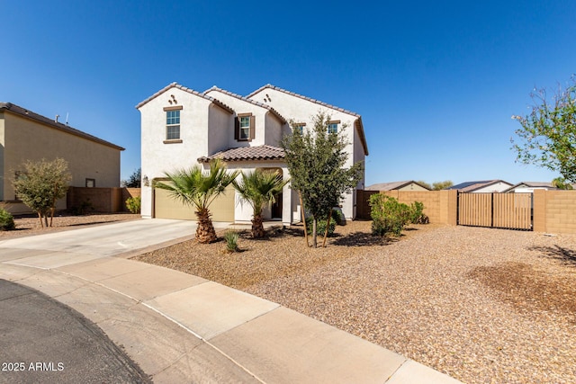 mediterranean / spanish-style house with driveway, a tiled roof, an attached garage, and fence