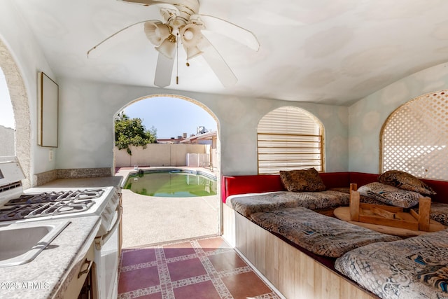 3135 W Echo Ln, Phoenix, AZ 85051 - interior space with multiple windows, sink, access to outside, and ceiling fan