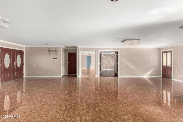 empty room featuring crown molding