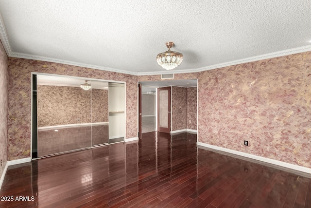 3135 W Echo Ln, Phoenix, AZ 85051 - spare room featuring dark hardwood / wood-style flooring, crown molding, and a textured ceiling