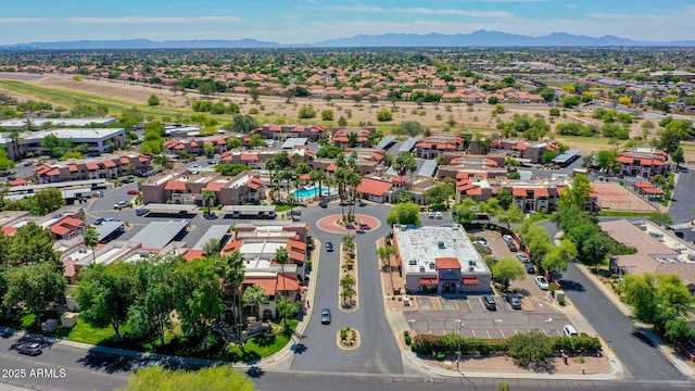 birds eye view of property with a mountain view