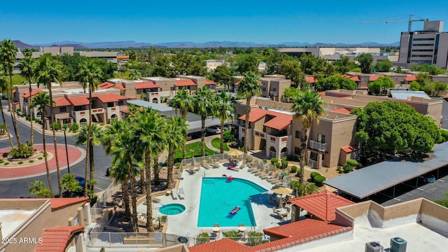 birds eye view of property with a mountain view