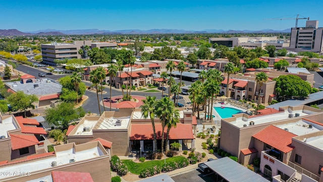 drone / aerial view featuring a residential view and a mountain view