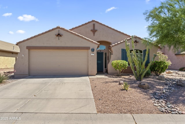 10333 E Gold Nugget Ct, Gold Canyon, AZ 85118 - mediterranean / spanish-style house featuring driveway, a garage, stucco siding, and a tile roof