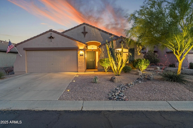 10333 E Gold Nugget Ct, Gold Canyon, AZ 85118 - view of front facade with concrete driveway, an attached garage, and stucco siding