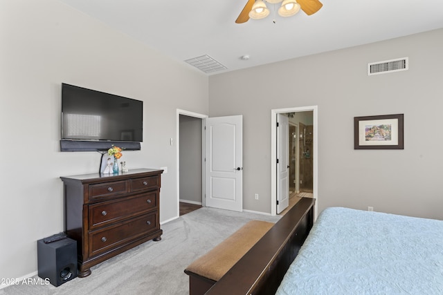10333 E Gold Nugget Ct, Gold Canyon, AZ 85118 - bedroom with light colored carpet, baseboards, ceiling fan, and ensuite bathroom