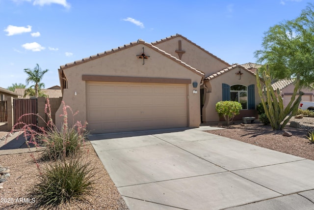 10333 E Gold Nugget Ct, Gold Canyon, AZ 85118 - mediterranean / spanish-style house featuring driveway, a garage, stucco siding, and a tile roof
