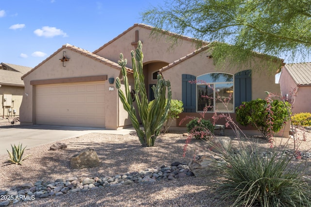 10333 E Gold Nugget Ct, Gold Canyon, AZ 85118 - mediterranean / spanish home with a garage, stucco siding, driveway, and a tiled roof