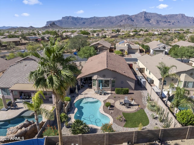 10333 E Gold Nugget Ct, Gold Canyon, AZ 85118 - aerial perspective of suburban area with a pool area and mountains