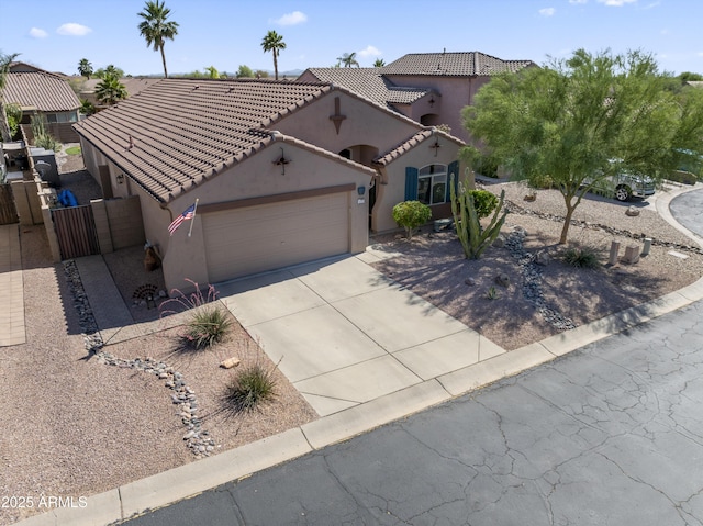 10333 E Gold Nugget Ct, Gold Canyon, AZ 85118 - mediterranean / spanish-style home featuring stucco siding, a tiled roof, a garage, and driveway