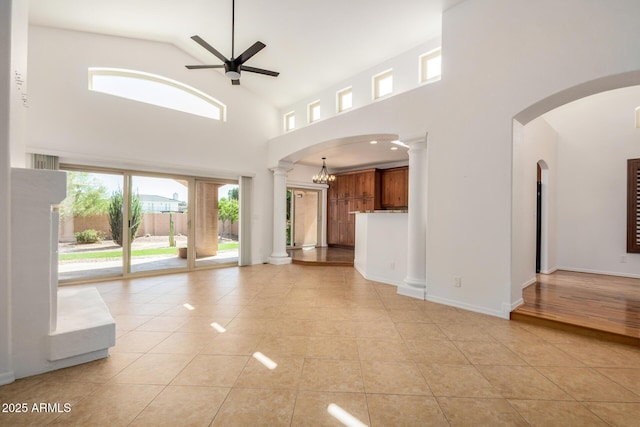 2226 N Gentry, Mesa, AZ 85213 - unfurnished living room featuring a ceiling fan, light tile patterned floors, high vaulted ceiling, and arched walkways